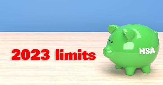 Piggy bank with HSA written on the side on top of light wood and blue background 3D rendering